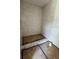 Unfinished shower featuring tiled walls and a step into the shower at 3403 W Leona St, Tampa, FL 33629