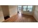 Bright bedroom with laminate flooring and access to backyard at 410 73Rd Ave, St Pete Beach, FL 33706