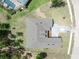 Bird's-eye view of the property showcases the roof, backyard, and extended driveway area at 4880 Hickory Oak Dr, Brooksville, FL 34601