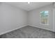 Bedroom featuring light gray paint and a view from the window of the community outside at 4880 Hickory Oak Dr, Brooksville, FL 34601
