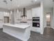 Modern kitchen with sleek white cabinets and stainless steel appliances at 4880 Hickory Oak Dr, Brooksville, FL 34601