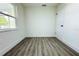 Spacious bedroom featuring neutral walls and vinyl flooring at 9085 Dorsey St, Spring Hill, FL 34608