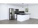 Modern kitchen with stainless steel appliances and an island at 9085 Dorsey St, Spring Hill, FL 34608