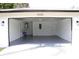 Spacious garage with epoxy flooring and extra storage at 9085 Dorsey St, Spring Hill, FL 34608