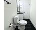 Stylish bathroom with black and white tile floors at 9085 Dorsey St, Spring Hill, FL 34608