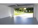 Garage with open door view of backyard at 9085 Dorsey St, Spring Hill, FL 34608