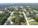 Aerial view of neighborhood with lush green spaces at 9085 Dorsey St, Spring Hill, FL 34608