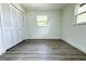 Spacious bedroom with double closet and wood-look floors at 9085 Dorsey St, Spring Hill, FL 34608
