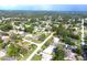 Aerial view of a residential neighborhood showcasing various houses and landscaping at 9085 Dorsey St, Spring Hill, FL 34608
