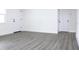 Bright and airy living room with vinyl flooring and neutral walls at 9085 Dorsey St, Spring Hill, FL 34608