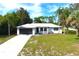 Single story home with driveway and landscaped lawn at 9085 Dorsey St, Spring Hill, FL 34608