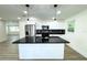 Modern kitchen with stainless steel appliances and black countertops at 9085 Dorsey St, Spring Hill, FL 34608