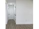 Bright hallway with laminate wood floors and neutral walls at 9085 Dorsey St, Spring Hill, FL 34608