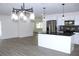 Modern kitchen island, stainless steel appliances, and open floor plan at 9085 Dorsey St, Spring Hill, FL 34608