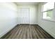 Bright bedroom with wood-look floors and ample closet space at 9085 Dorsey St, Spring Hill, FL 34608