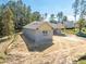 Aerial view of house under construction, showcasing side yard and landscaping at 4880 Hickory Oak Dr, Brooksville, FL 34601