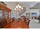 Formal dining room with a large wood table and chandelier at 1231 Corinth Greens Dr, Sun City Center, FL 33573