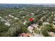 Aerial view showing home's location in a quiet tree-lined neighborhood at 1500 Mahogany Ln # 605, Palm Harbor, FL 34683