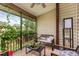 Relaxing screened porch with seating area at 1500 Mahogany Ln # 605, Palm Harbor, FL 34683