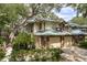 Two-story townhouse with attached garage and landscaping at 1500 Mahogany Ln # 605, Palm Harbor, FL 34683