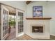 Living room with fireplace and access to balcony at 1500 Mahogany Ln # 605, Palm Harbor, FL 34683