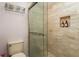 Clean bathroom with a walk-in shower and tile surround at 1500 Mahogany Ln # 605, Palm Harbor, FL 34683