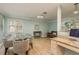 Bright dining area with glass table and gray chairs at 1500 Mahogany Ln # 605, Palm Harbor, FL 34683