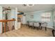 Bright dining area, view of kitchen and staircase at 1500 Mahogany Ln # 605, Palm Harbor, FL 34683