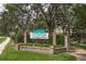 Community entrance sign, Laurel Oaks, with landscaping at 1500 Mahogany Ln # 605, Palm Harbor, FL 34683