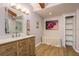 Modern bathroom with light wood vanity and a large mirror at 1500 Mahogany Ln # 605, Palm Harbor, FL 34683