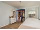 Bedroom with double closet and white dresser at 1500 Mahogany Ln # 605, Palm Harbor, FL 34683