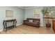Living room with brown leather couch and console table at 1500 Mahogany Ln # 605, Palm Harbor, FL 34683