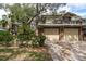 Two story home with two car garage and lush landscaping at 1500 Mahogany Ln # 605, Palm Harbor, FL 34683