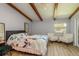 Spacious bedroom with hardwood floors and a king-size bed at 1500 Mahogany Ln # 605, Palm Harbor, FL 34683