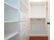 Spacious walk-in closet with shelves and hanging rods at 304 Kelsey Way # 2, Sun City Center, FL 33573