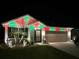 Charming home exterior with festive holiday lighting at 1523 Glen Grove Loop, Wesley Chapel, FL 33543