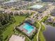 Community lap pool, basketball court, and homes at 1523 Glen Grove Loop, Wesley Chapel, FL 33543
