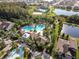 Community pool and clubhouse with surrounding homes at 1523 Glen Grove Loop, Wesley Chapel, FL 33543