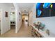 Long hallway with access to bedrooms and living areas at 1523 Glen Grove Loop, Wesley Chapel, FL 33543