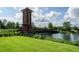 Union Park community entrance with a wooden bridge over a pond at 1523 Glen Grove Loop, Wesley Chapel, FL 33543