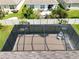 Spacious screened pool and patio area with seating at 1523 Glen Grove Loop, Wesley Chapel, FL 33543