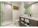 Modern bathroom with gray tile, walk-in shower, and floating vanity at 301 1St S # 2502, St Petersburg, FL 33701