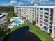 Unit #1207 highlighted in aerial view, showcasing pool and pond at 225 Country Club Dr # 1207, Largo, FL 33771