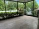 Spacious screened patio with wood-look tile flooring at 2126 Richwood Pike Dr, Ruskin, FL 33570