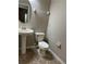 Clean bathroom with pedestal sink and tiled floors at 2126 Richwood Pike Dr, Ruskin, FL 33570