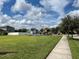 Pathway next to a grassy area with a playground at 2126 Richwood Pike Dr, Ruskin, FL 33570