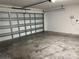 Attached garage with concrete floor at 2126 Richwood Pike Dr, Ruskin, FL 33570
