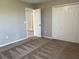 Bedroom with door to another room and closet at 2126 Richwood Pike Dr, Ruskin, FL 33570
