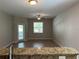 Living room with tile floors and sliding glass doors at 2126 Richwood Pike Dr, Ruskin, FL 33570