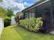 Spacious backyard with lush landscaping and covered patio at 2126 Richwood Pike Dr, Ruskin, FL 33570